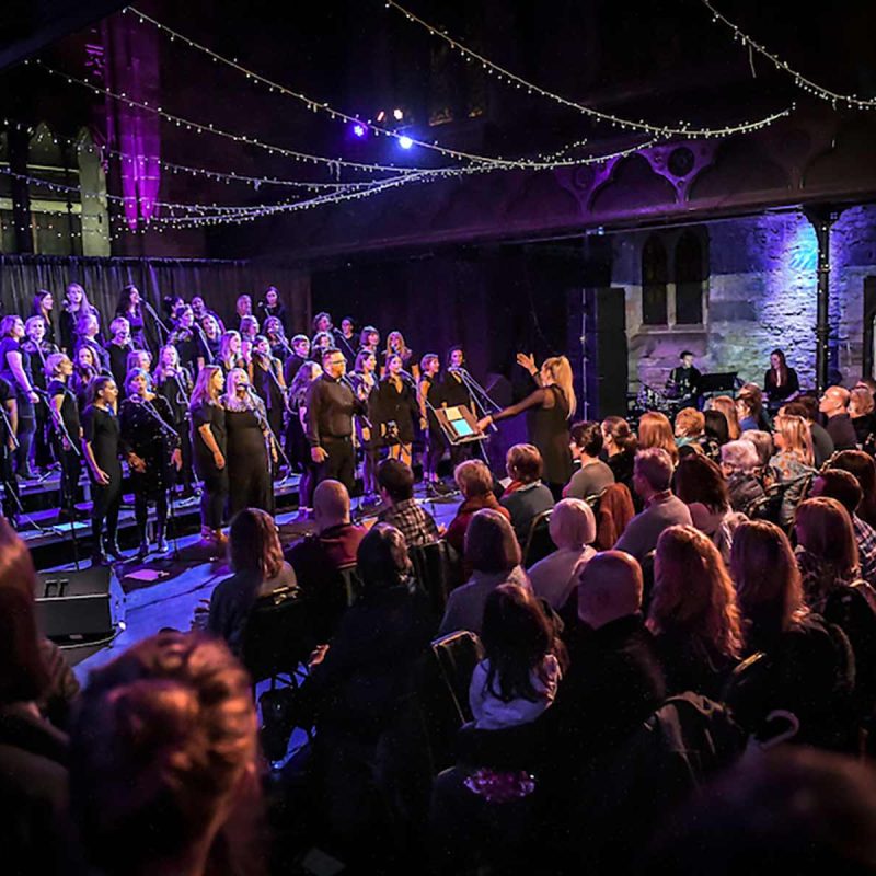 Cottiers - Interior of theatre showing a performance of the Glasgow VOTT Choir.